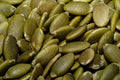 Pumpkin Seeds - A detailed macro shot of a pile of fresh green pumpkin seeds, perfect for healthy eating concepts.