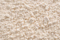 Potato Starch - Detailed close-up of a white powder texture, resembling flour or sugar.
