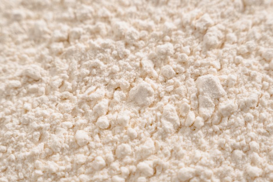 Potato Starch - Detailed close-up of a white powder texture, resembling flour or sugar.